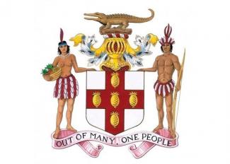 Wappen Jamaicas mit dem Schriftzug „Out of many, one people"
